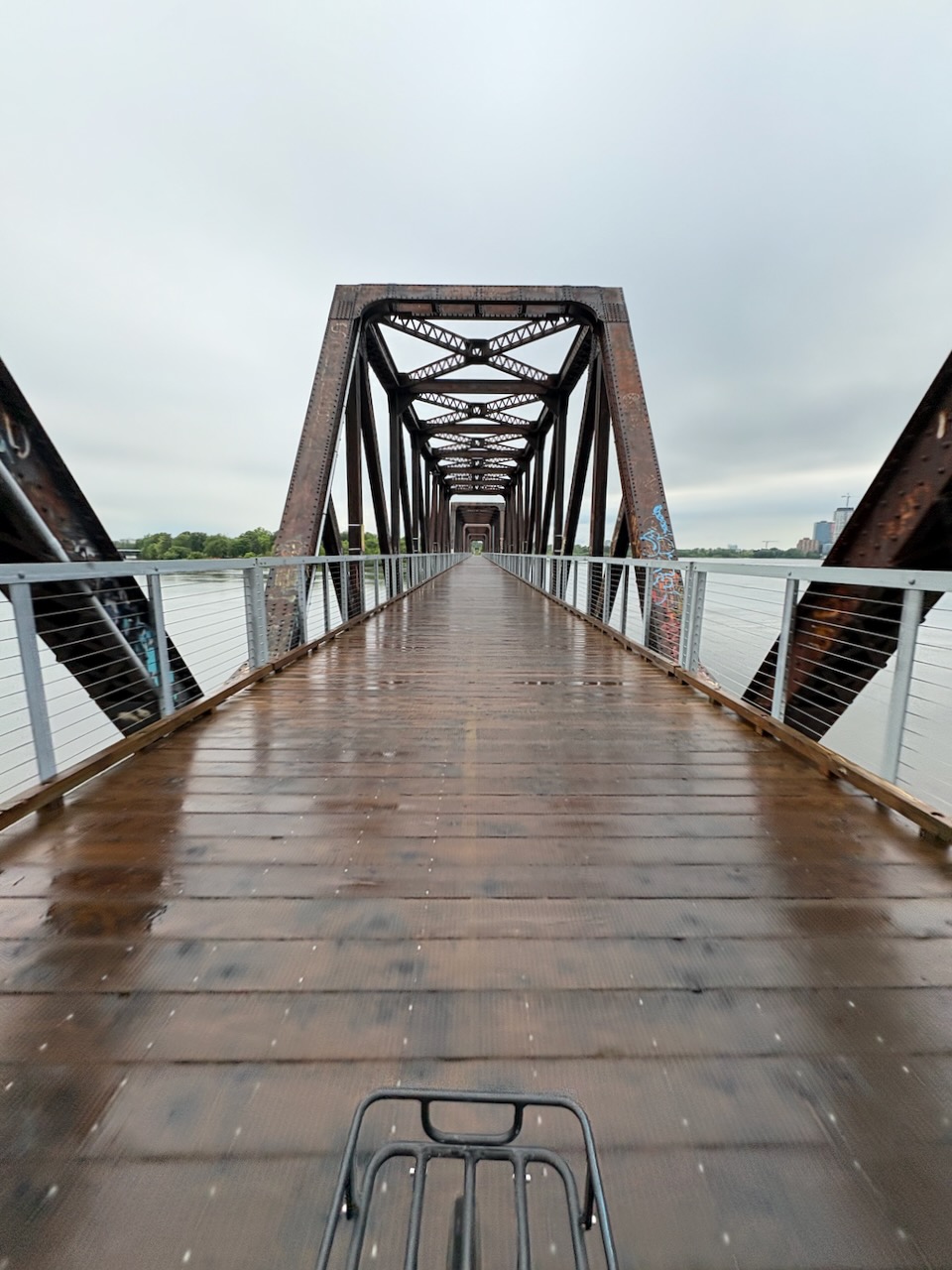 A cyclist riding into a bridge