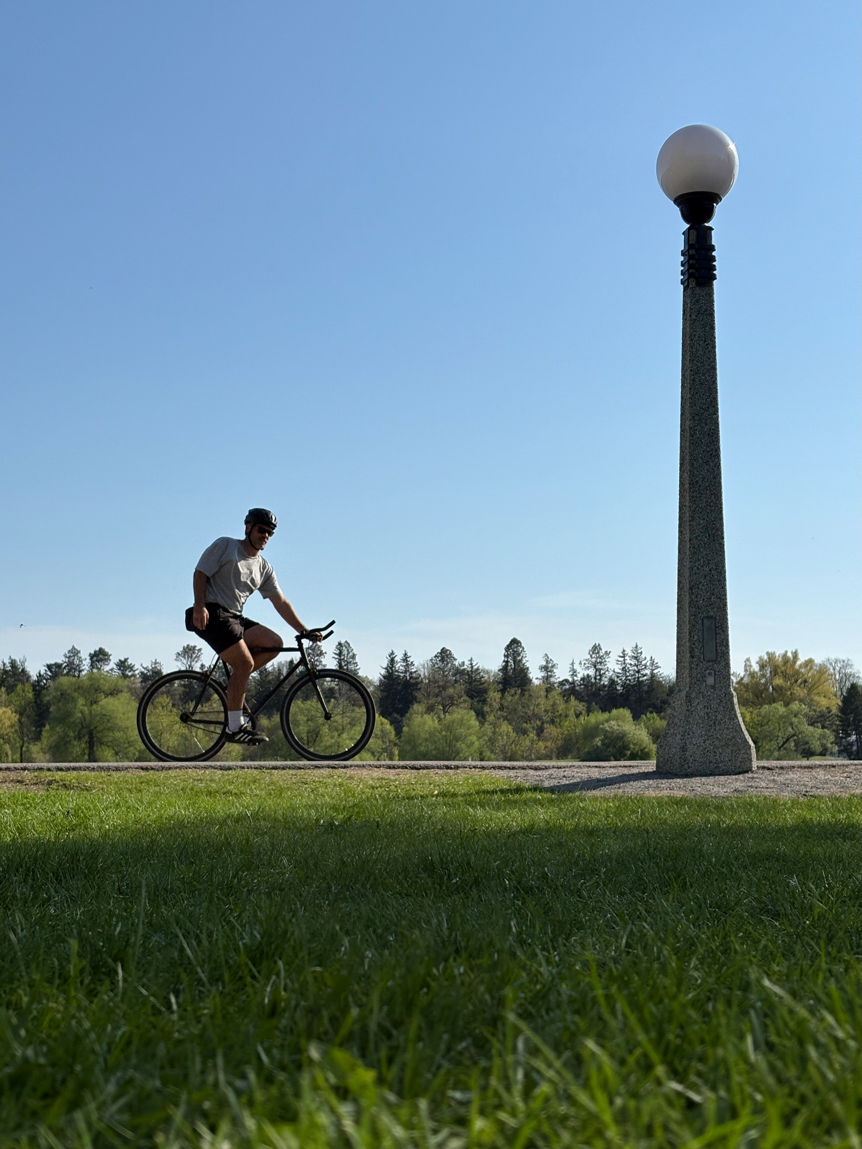 A cyclist and a lamp post